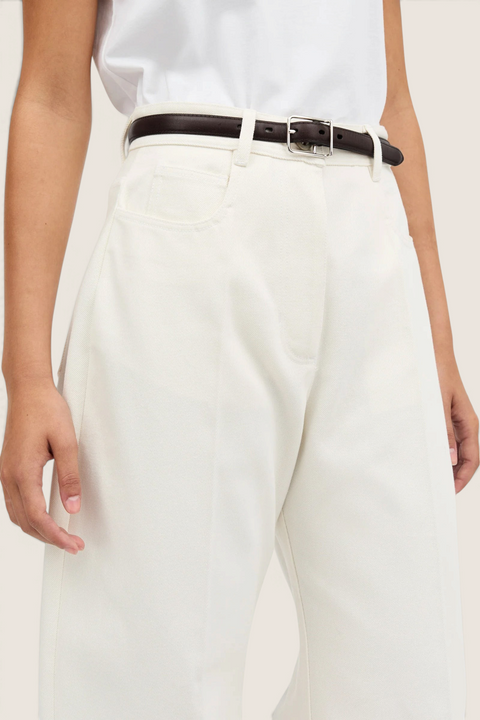 Bolina Pella ivory denim jeans with a high waist, loose barrel leg fit, and a dark brown leather belt.