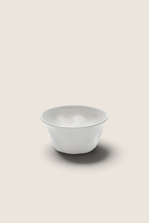 Bolina Silhouette white porcelain cereal bowl with organic, soft lines and a glossy finish on a plain background.