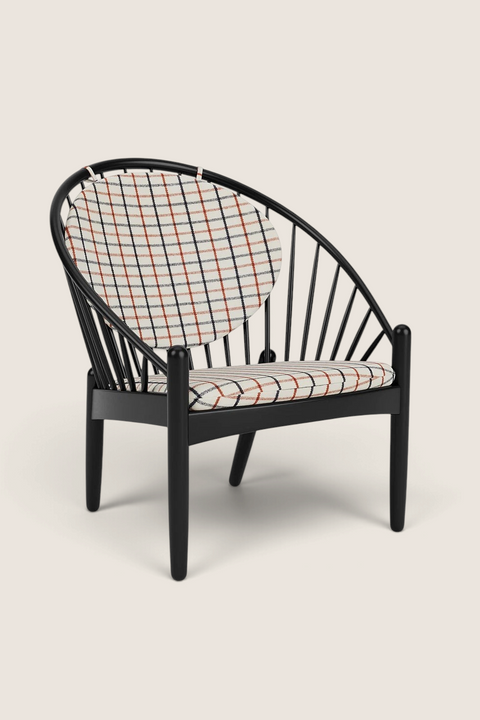 Bolina J166 Jørna lounge chair in black oak with red plaid upholstered cushions, featuring a classic spindle back design.