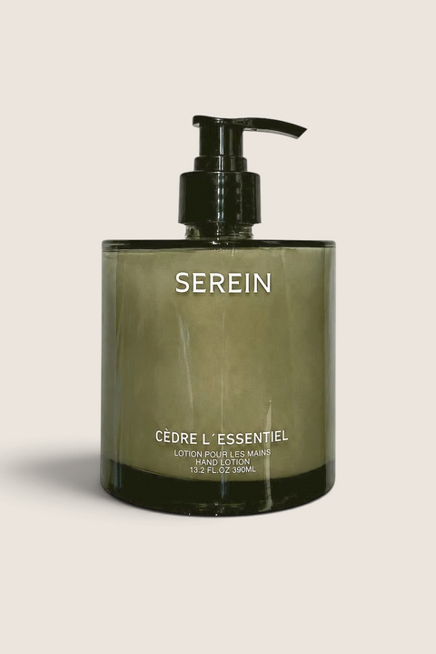 Bolina Serein Cèdre L'essentielle hand lotion in a green glass bottle with a black pump dispenser