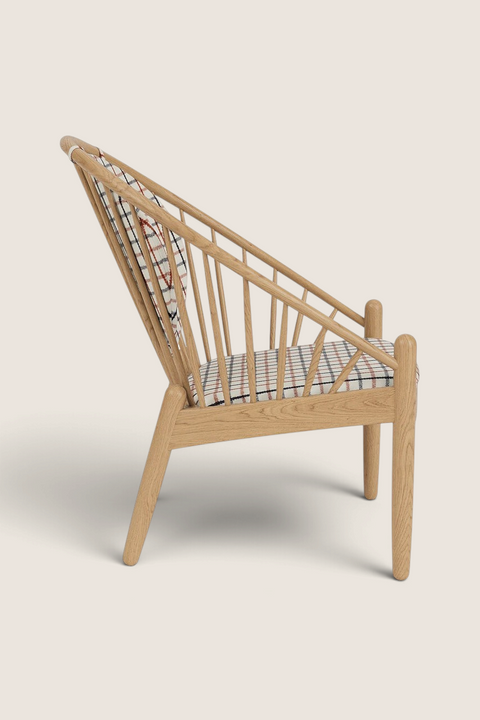 Bolina J166 Jørna lounge chair in lacquered oak with red plaid wool cushions, side view showing spindle back design.