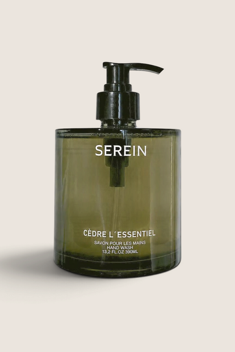 Bolina Serein Cèdre L'essentielle hand wash in a dark green glass bottle with a black pump dispenser.