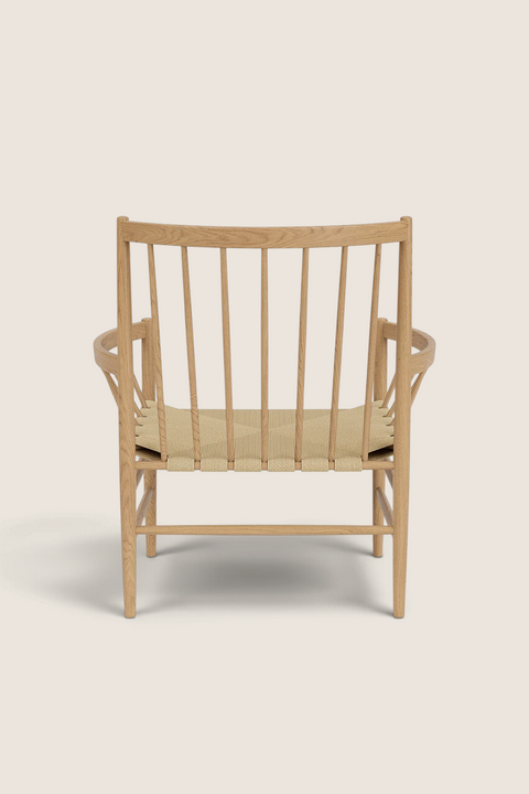 Bolina J82 lounge chair in lacquered oak with a woven paper cord seat, shown from a straight back view.