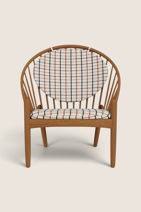 Bolina J166 Jørna lounge chair in smoked oak with red plaid Horserug fabric cushions and iconic spindle back design.