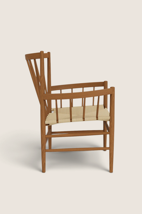 Bolina J82 lounge chair in smoked oak with a natural paper cord seat, featuring a high spindle back and armrests.