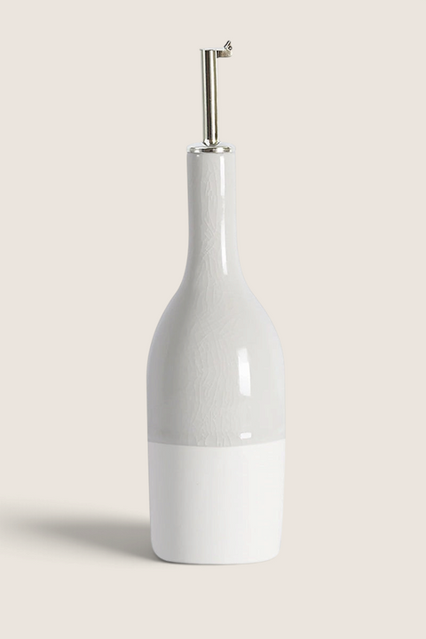 Bolina Maguelone Quartz handmade ceramic oil bottle in grey with a glossy crackle glaze and metal pourer spout.