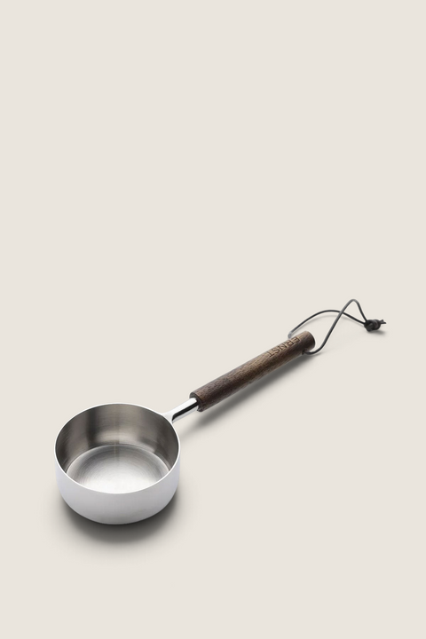 Bolina Ernst 1 dl measuring cup with a stainless steel bowl and a dark brown mango wood handle with a leather cord.