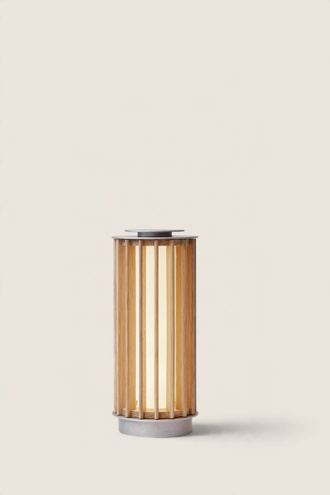 Bolina &Tradition Numbra TY3 portable table lamp in oak and aluminium with a cylindrical slatted design.