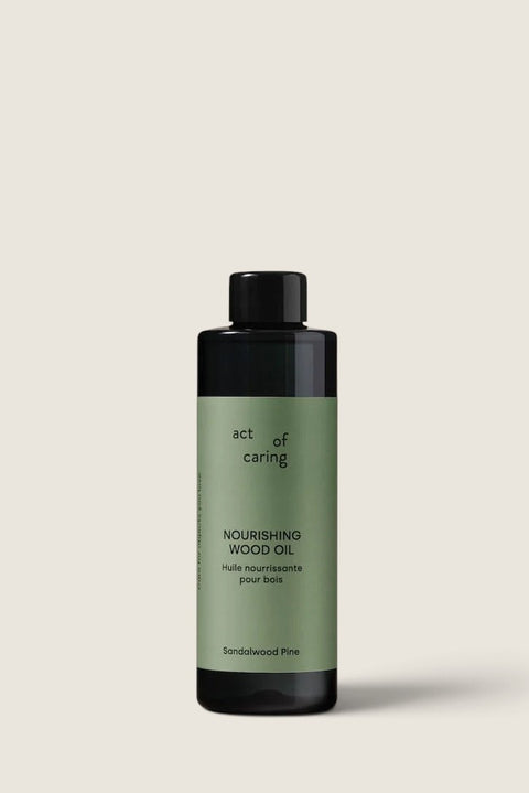 Bolina Act of Caring Nourishing Wood Oil in a 200ml bottle with a green label for wood furniture and surfaces.