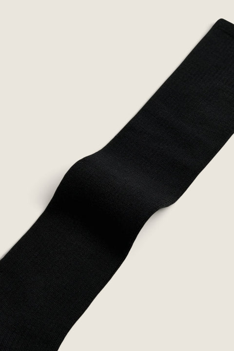 Bolina Aiayu black rib-knit wool knee-high socks with a soft, thin texture and elastic fit.