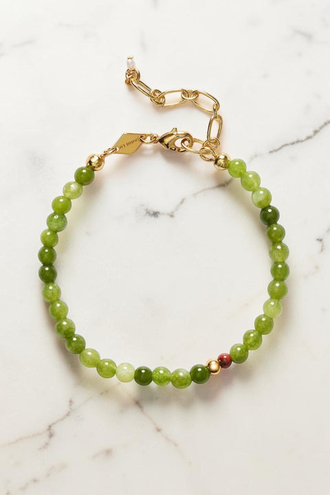 Bolina ANNI LU Grasshopper bracelet featuring green olivine beads, a red jasper accent, and gold-plated hardware.
