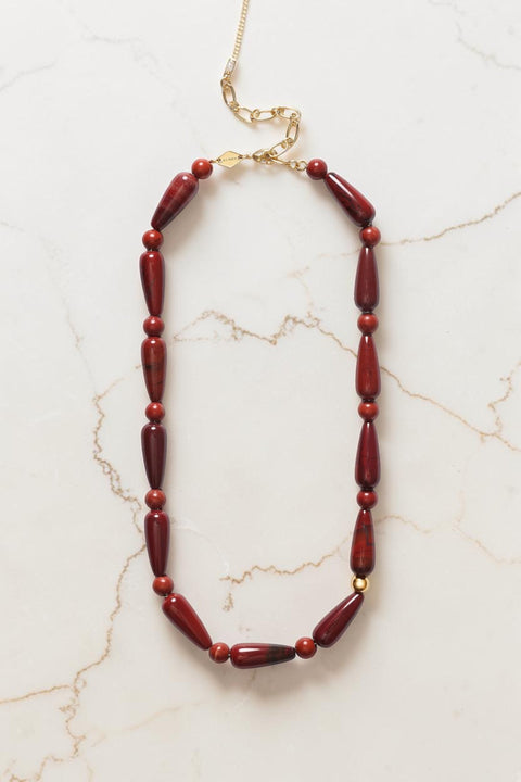 Bolina ANNI LU Hot Drops necklace featuring deep red jasper beads in round and elongated shapes with a gold accent.