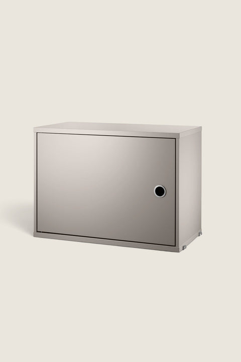 Bolina beige lacquered MDF cabinet for String System with a single hinged door and adjustable interior shelf.