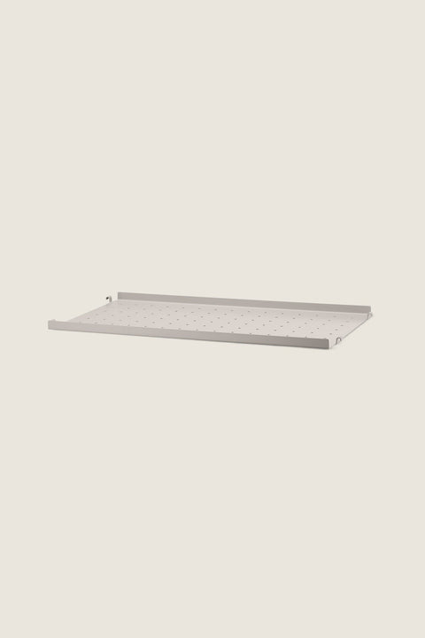 Bolina beige powder-coated steel shelf with low edge for String System, 58x30 cm with perforated surface.
