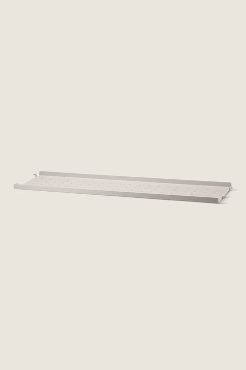 Bolina beige perforated metal shelf with low edge for String System, 78x20 cm size.