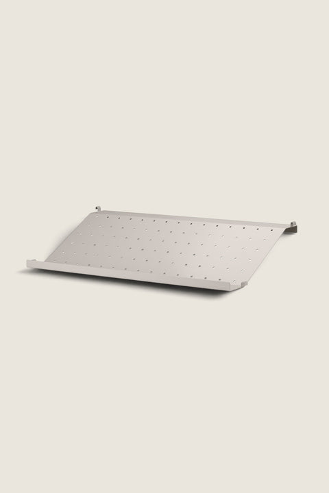 Bolina beige metal shoe shelf for String System with perforated design, 58cm wide for 30cm deep side panels.