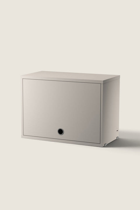 Bolina beige String System flip door cabinet made of lacquered MDF with a minimalist design and circular handle.