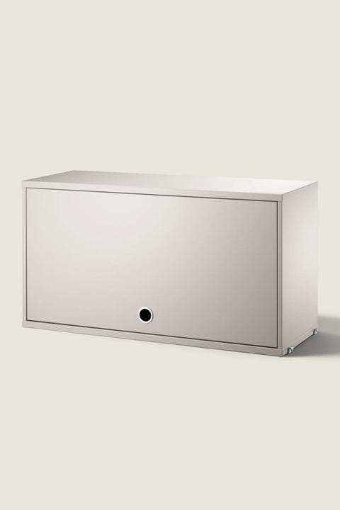 Bolina beige String System flip door cabinet with a minimalist design and circular handle for wall mounting