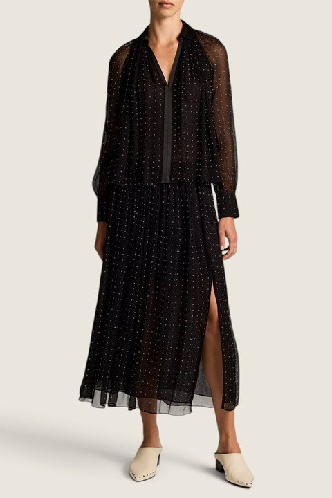Bolina black sheer chiffon midi skirt with white polka dots, gathered waist, and side slit worn with matching blouse