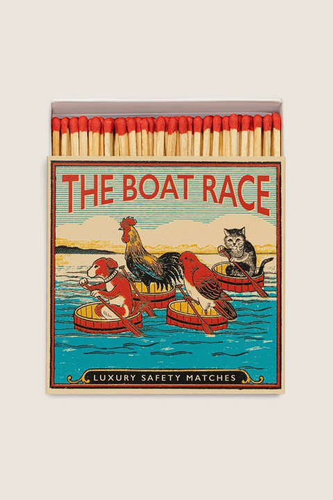 Bolina decorative matchbox featuring a whimsical boat race illustration of a dog, cat, hen, and bird with red tips.