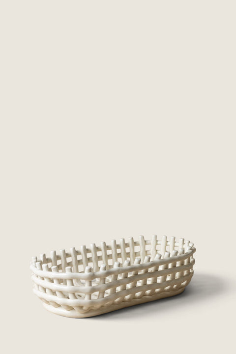 Bolina off-white ceramic bread basket with a woven design, handmade in a modern style for fruit or bread storage.