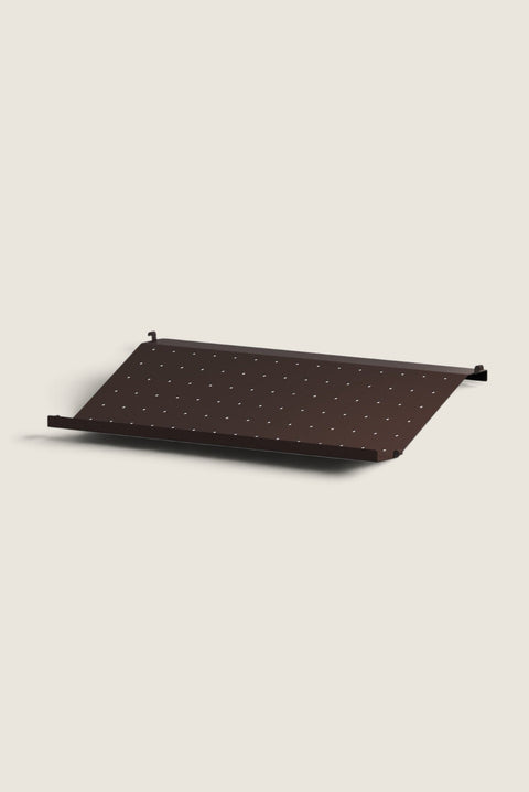 Bolina dark brown metal shoe shelf for String System, featuring a perforated design for organized hallway storage.
