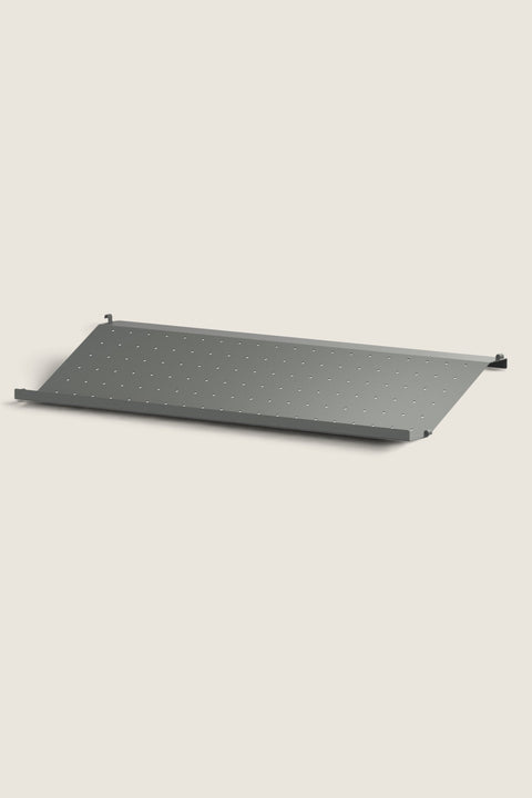 Bolina dark grey perforated metal shoe shelf for String System, 78cm wide and 30cm deep for wall-mounted storage.