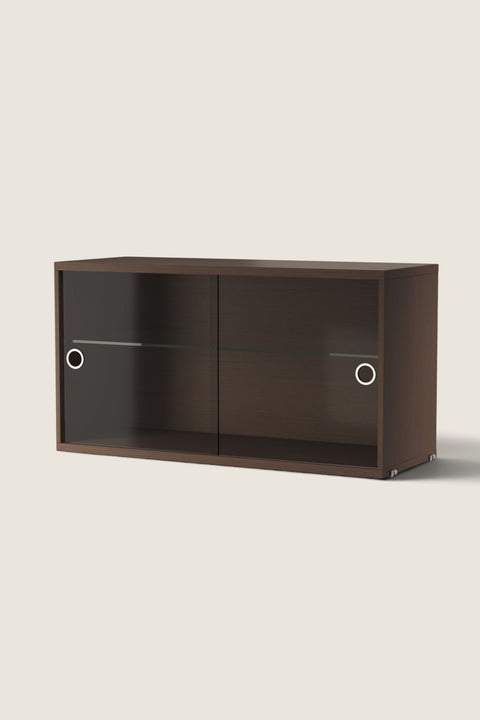Bolina dark oak cabinet with sliding glass doors and internal shelf for String System shelving units.