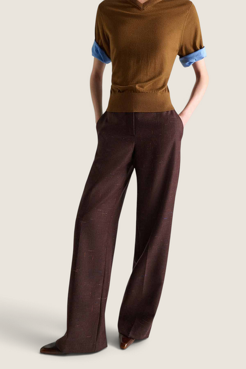 Bolina Dorothee Schumacher cinnamon tweed trousers with wide legs and pressed creases worn with a brown sweater