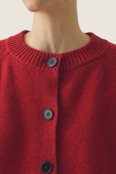 Bolina Eden raglan cardigan in cardinal red merino wool and cashmere blend with ribbed neckline and corozo buttons.
