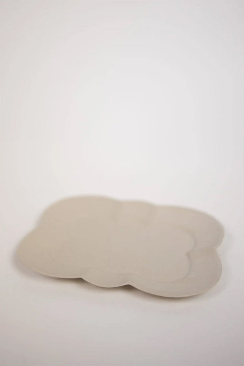 Bolina Fabian white stoneware plate with a soft flower-shaped edge and thin profile for serving small dishes.