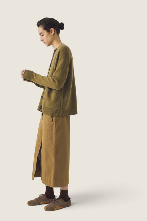 Bolina Ffion boxy cardigan in golden pear wool cashmere blend with V-neck and patch pockets, worn by a model.