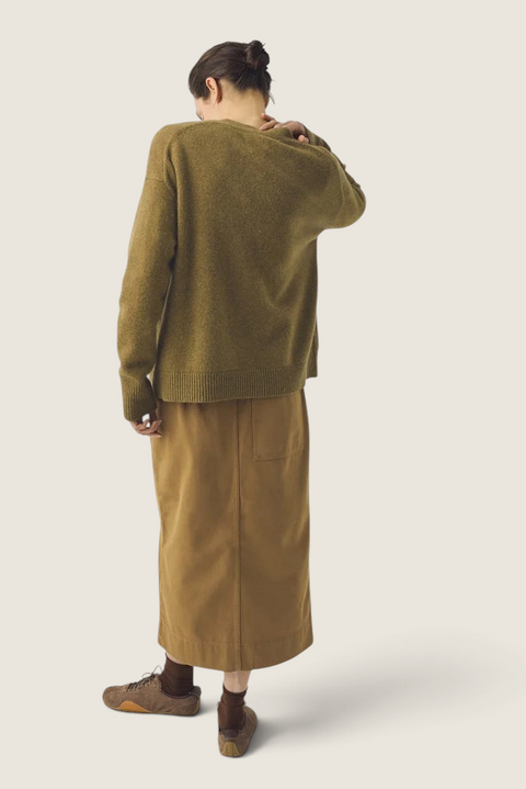 Bolina Ffion boxy cardigan in golden pear wool cashmere blend worn by a model from the back view