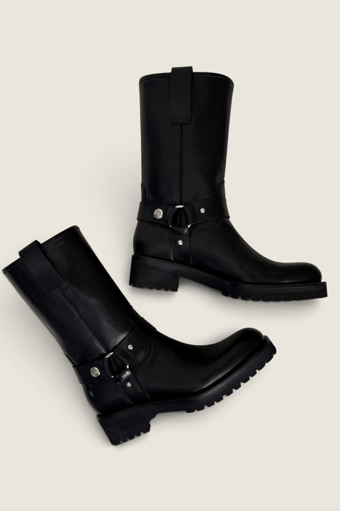 Bolina Isabel mid-calf boots in black glossy leather with silver ring hardware and chunky rubber soles.