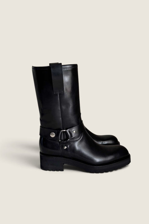 Bolina Isabel mid-calf boots in black glossy leather with silver ring hardware and a chunky black rubber sole.