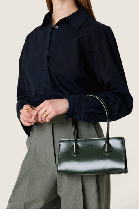 Bolina LIÉ STUDIO Lou olive green patent leather shoulder bag with a glossy finish and slim rectangular shape.