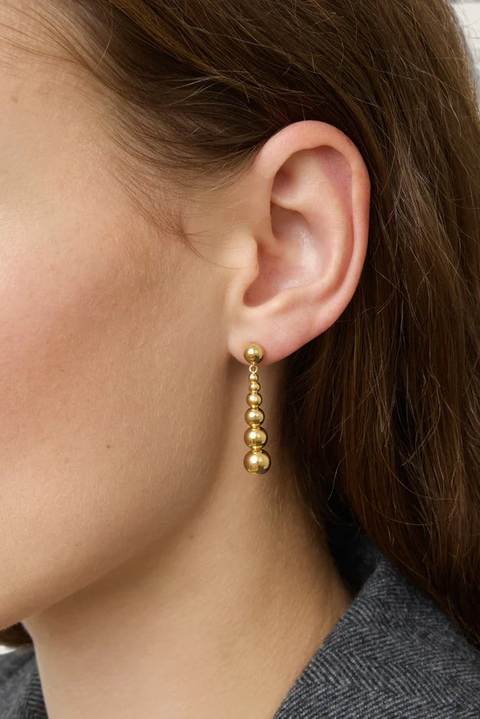 Bolina LIÉ STUDIO The Rebecca gold drop earrings featuring a delicate vertical chain of polished graduated spheres.