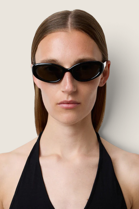 Bolina LIÉ STUDIO The Robyn black cat-eye sunglasses with rounded acetate frames worn by a model