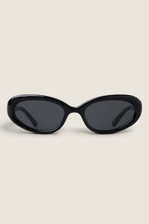 Bolina LIÉ STUDIO The Robyn black cat-eye sunglasses with a rounded acetate frame and dark lenses.