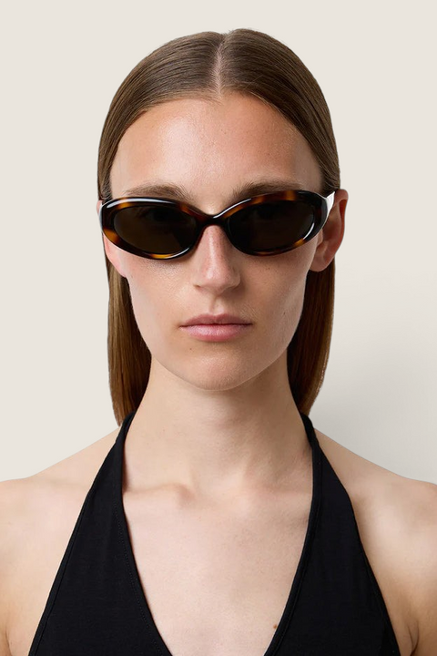 Bolina LIÉ STUDIO Robyn cat-eye sunglasses in dark tortoise shell pattern worn by a woman