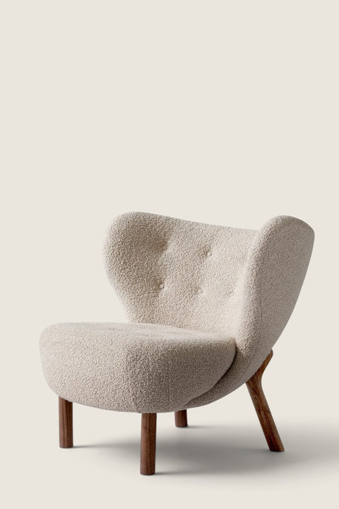 Bolina Little Petra lounge chair in cream Karakorum bouclé fabric with dark walnut wood legs