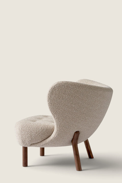 Bolina Little Petra lounge chair in cream Karakorum wool fabric with dark walnut wood legs, back view