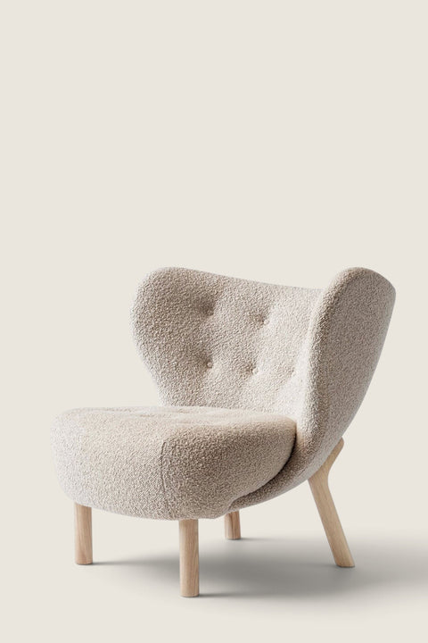 Bolina Little Petra lounge chair upholstered in cream Karakorum fabric with light oak wood legs