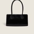 Bolina Lou bag in black patent leather with a slim, elongated shape and long shoulder straps.