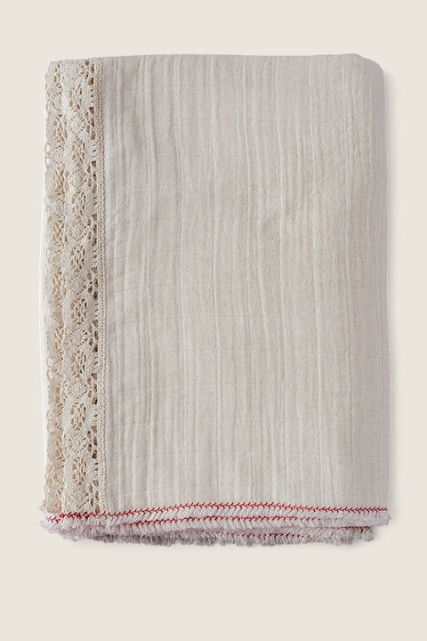Bolina natural pre-washed cotton tablecloth with delicate lace trim and decorative red stitched raw edge detail.