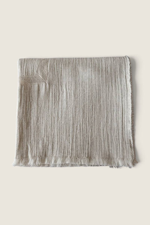 Bolina natural melange tablecloth with net lace trim and frayed edges for a nostalgic, soft textured table setting.