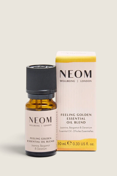 Bolina NEOM Feeling Golden essential oil blend in a 10ml amber glass bottle with its matching floral packaging box.