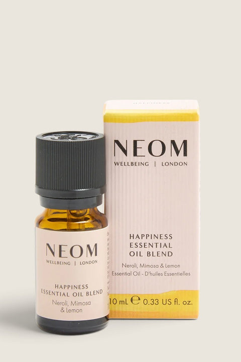 Bolina Neom Happiness essential oil blend in a 10ml amber glass bottle with its pale pink and yellow product box.