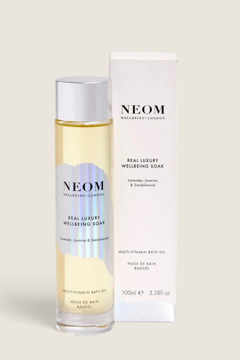 Bolina Neom Real Luxury multi-vitamin bath oil in a clear glass bottle with white packaging box.