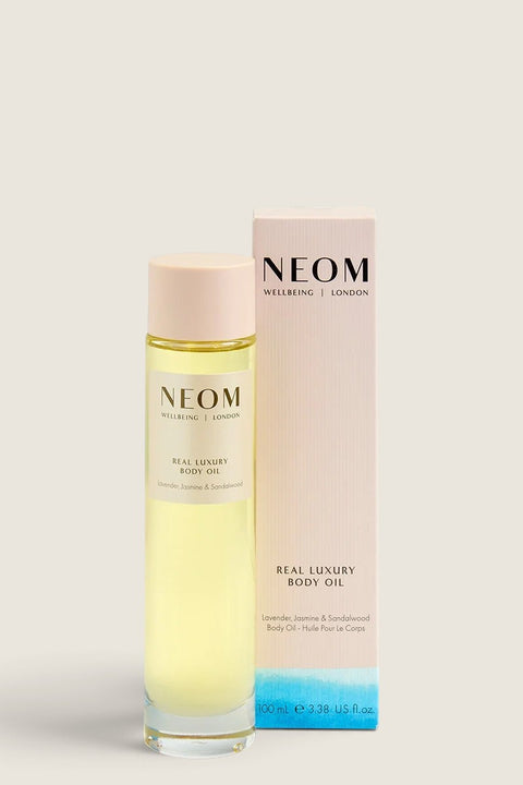 Bolina Neom Real Luxury body oil in a 100ml glass bottle with a pale pink box featuring lavender and jasmine scent.